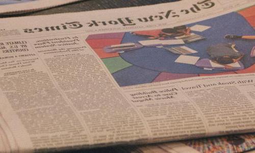 A newspaper on a table.